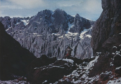 Heinrich Harrer surveying the North Face of the Carstensz Pyramid from New Zealand Pass